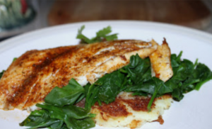 Pan Fried Blackened Barramudi with Steamed Spinach over Potato Pancakes